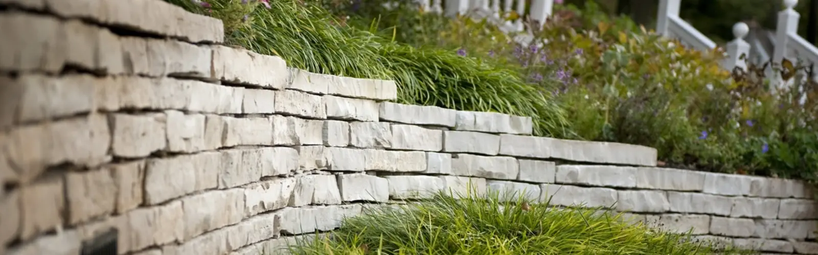 Stacked stone retaining wall by Landscape St. Louis